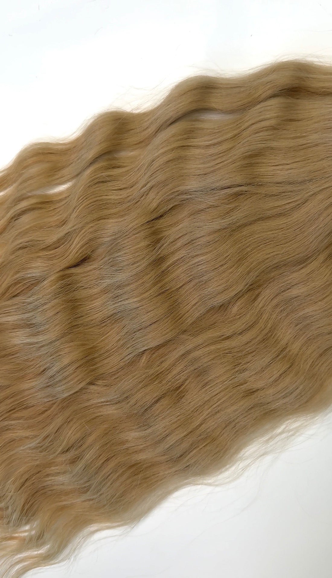 Shade No. 4 natural wavy K-tip hair extensions by Maven & Mane