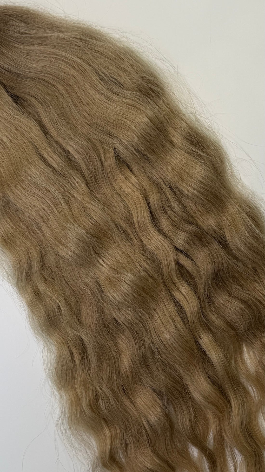 Shade No. 5 natural wavy K-tip hair extensions by Maven & Mane