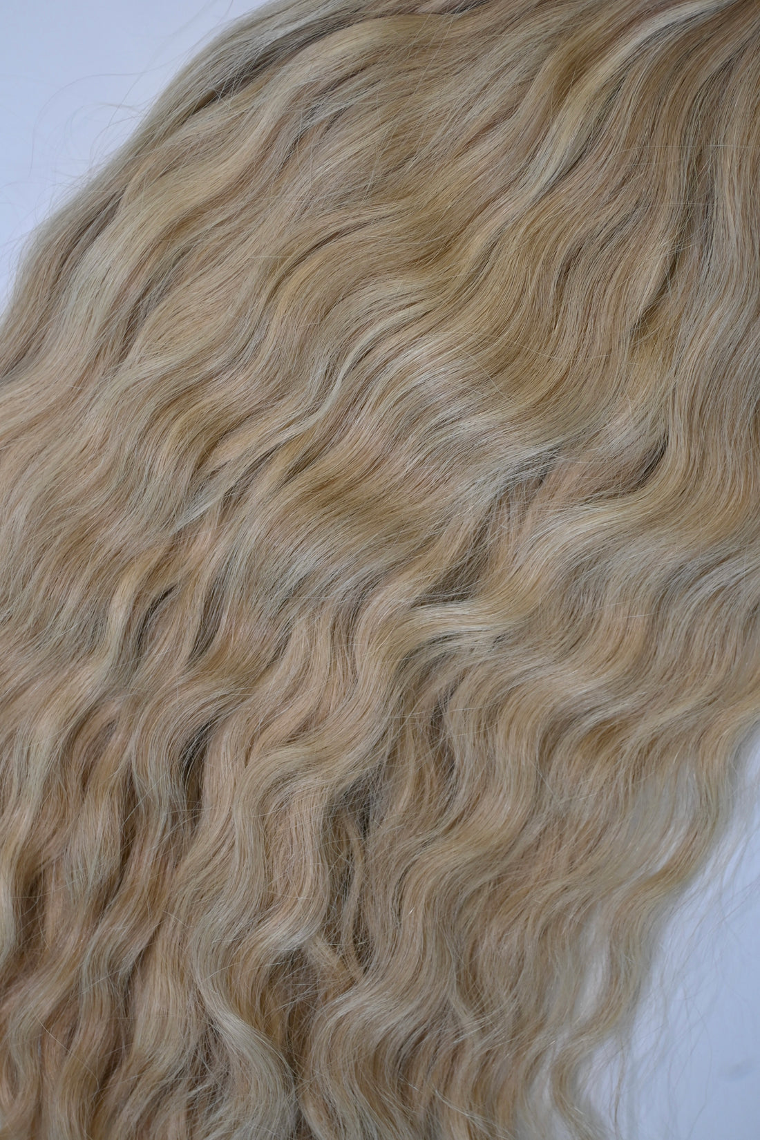 Shade No. 3 natural wavy K-tip hair extensions by Maven & Mane