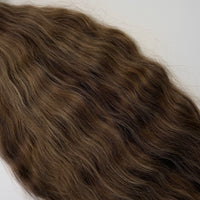 Shade No. 2 natural wavy K-tip hair extensions by Maven & Mane